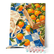 Laden Sie das Bild in den Galerie-Viewer, Orangen auf blau kariertem Stoff